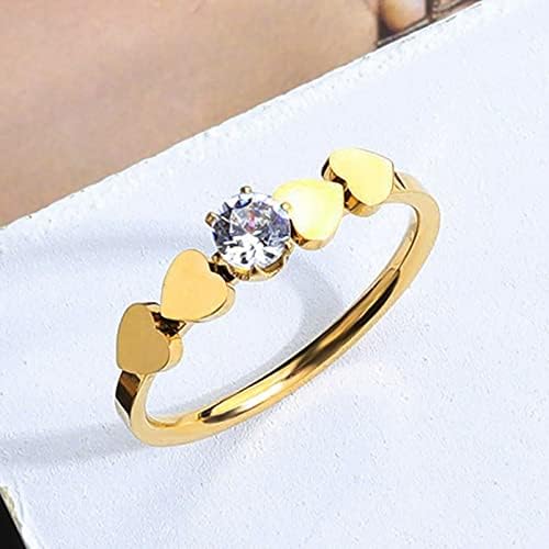 Womenените ветуваат прстен на личноста мода loveубов симетричен циркон венчален прстен предлог за не'рѓосувачки челик за појавување прстени